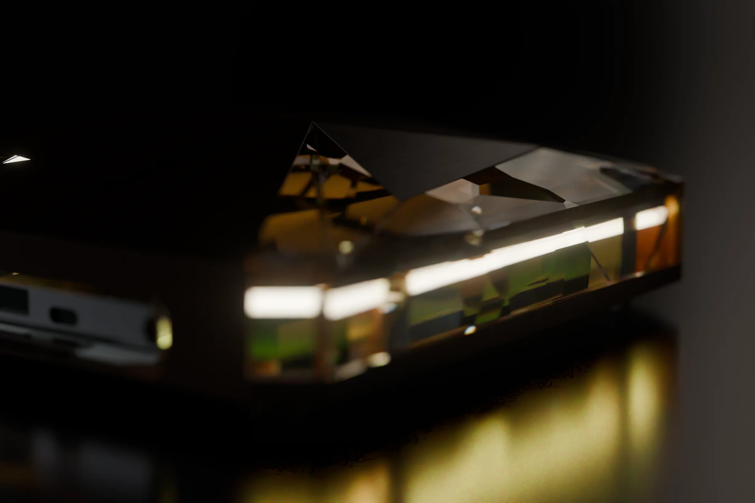 Close-up of the crystal band glowing amber in a dark room